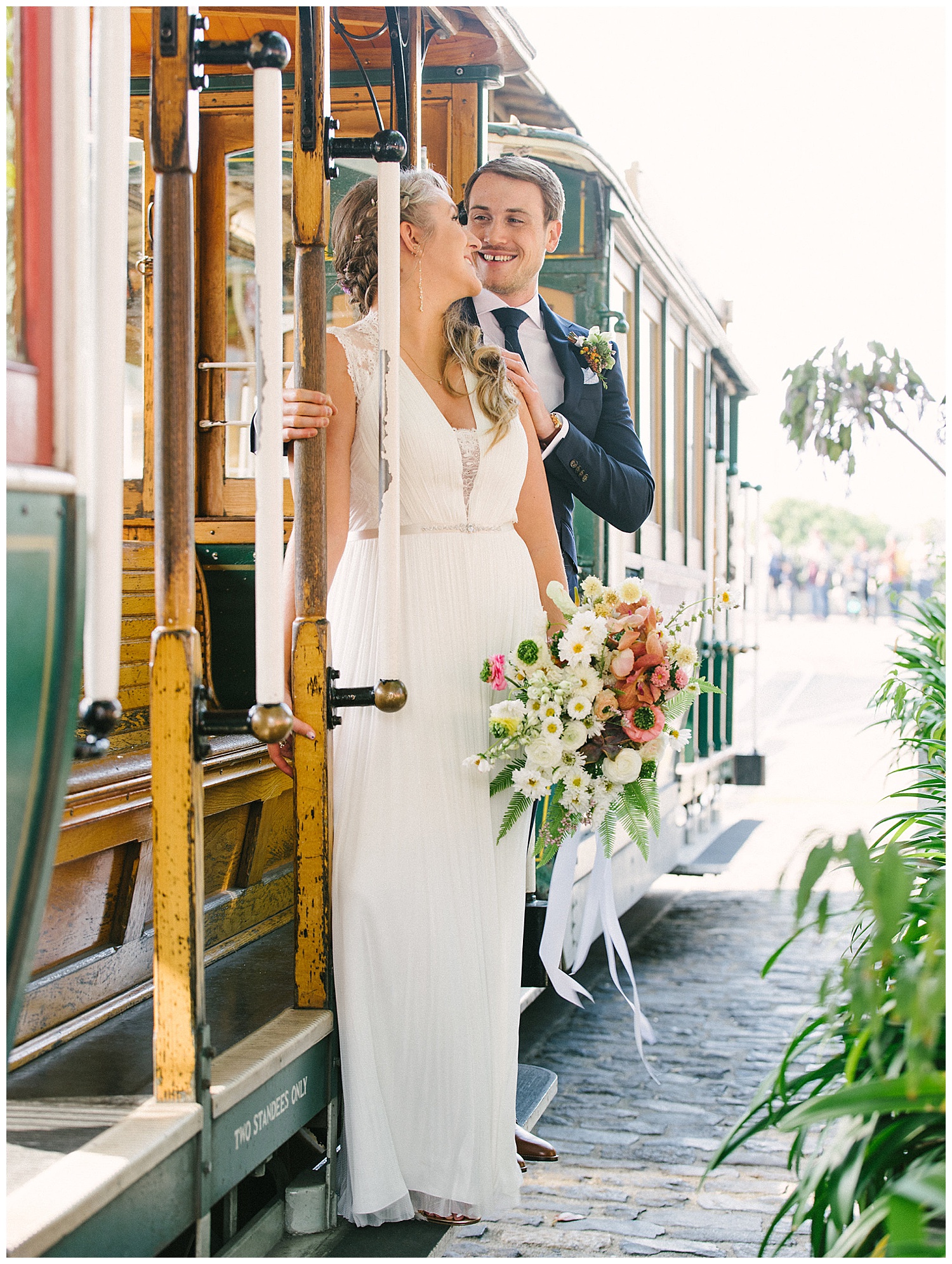 bride and groom portrait on trolley