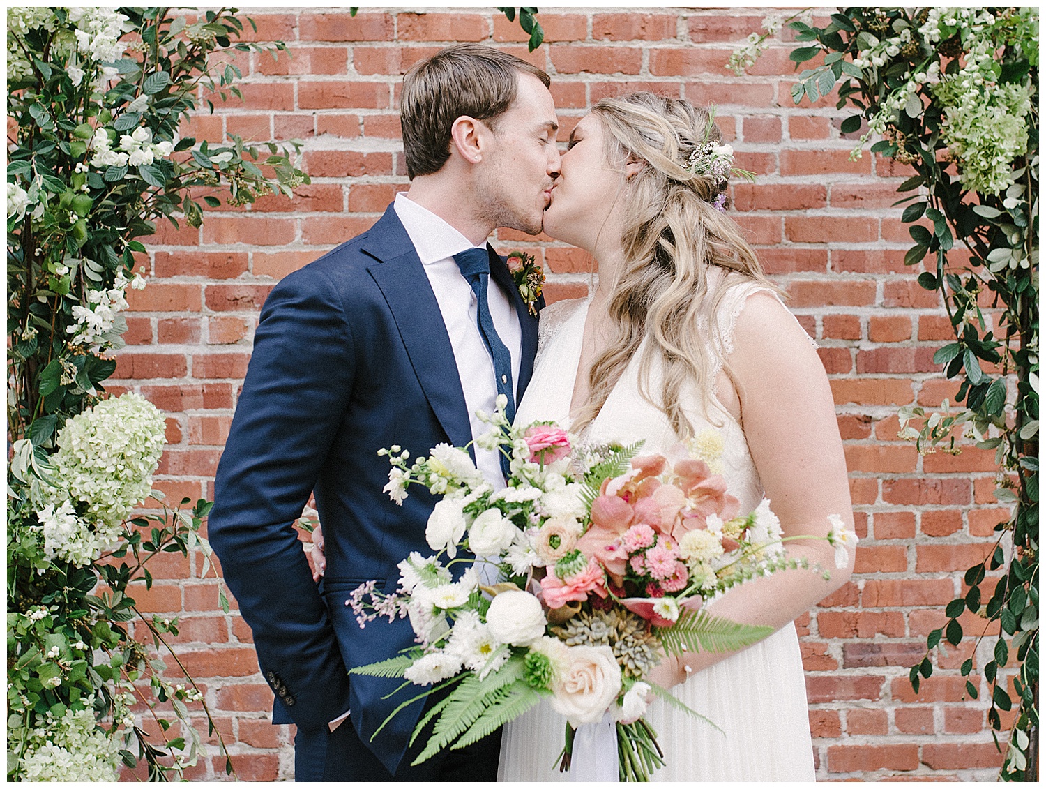 bride and groom kissing portraits